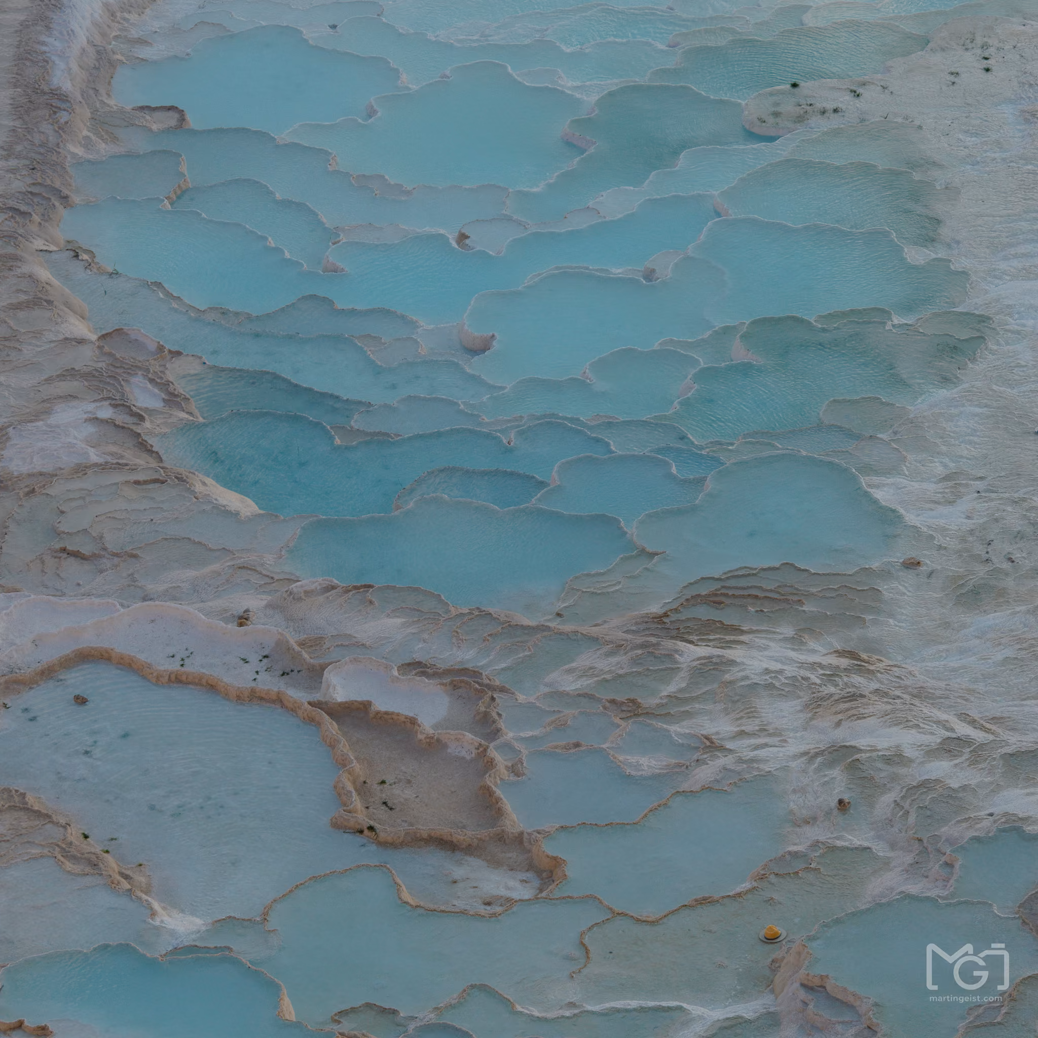 Peeling turquoise paint on a weathered surface